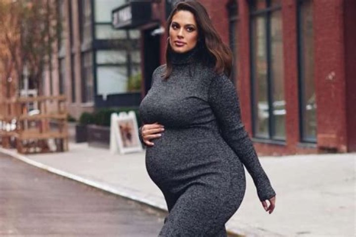 Ashley Graham Stuns In AFRM Dress With Tamara Mellon Boots As Baby Bump Grows Bigger