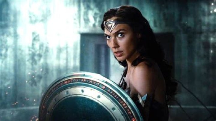 Gal Gadot fittingly relaxes in front of a roaring fire as the SnyderVerse burns to ashes in her absence